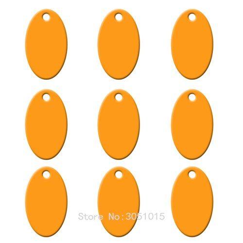 Wholesale pack of 100 oval aluminum pet ID tags, customizable with names and phone numbers, ideal for dog collars.